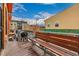 Wooden deck with bench and grill, overlooks neighboring buildings at 1944 W 33Rd Ave, Denver, CO 80211