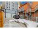 Garage with driveway, spiral staircase and small yard at 1944 W 33Rd Ave, Denver, CO 80211