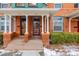 Two-story home with a classic porch and brick facade at 1944 W 33Rd Ave, Denver, CO 80211