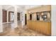 Open concept kitchen with granite countertops and wood cabinets at 1944 W 33Rd Ave, Denver, CO 80211