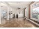 Living room with exposed brick walls and tiled floors at 1944 W 33Rd Ave, Denver, CO 80211