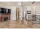 Living area with tiled floor, fireplace and stairway at 1944 W 33Rd Ave, Denver, CO 80211