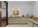 Bathroom featuring granite countertops, custom cabinets, a large mirror, and an abundance of storage at 11790 Huckleberry Drive Dr, Franktown, CO 80116