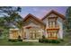 Stunning home with stone accents, a covered patio, and lush landscaping at 11790 Huckleberry Drive Dr, Franktown, CO 80116