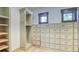 Custom walk-in closet with built-in shelving and drawer storage at 11790 Huckleberry Drive Dr, Franktown, CO 80116