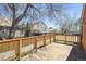 Inviting wooden back deck providing an ideal setting for outdoor relaxation and neighborhood views at 10262 W Ida Ave # 243, Littleton, CO 80127