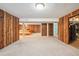 Spacious finished basement featuring wood paneling and a sauna at 10262 W Ida Ave # 243, Littleton, CO 80127