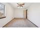 Comfortable bedroom featuring a ceiling fan and natural light at 10262 W Ida Ave # 243, Littleton, CO 80127