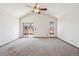 Spacious bedroom featuring vaulted ceilings, a ceiling fan, and a sliding glass door to a deck at 10262 W Ida Ave # 243, Littleton, CO 80127