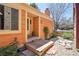 Inviting front entrance with a wooden porch and rock garden landscaping for a welcoming approach at 10262 W Ida Ave # 243, Littleton, CO 80127