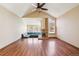 Spacious living room featuring a vaulted ceiling, fireplace, and a built-in seating area at 10262 W Ida Ave # 243, Littleton, CO 80127