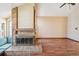 Bright living room featuring fireplace, hardwood floors, and vaulted ceilings at 10262 W Ida Ave # 243, Littleton, CO 80127