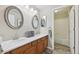 Bathroom featuring a double vanity and ample storage at 9385 Prairie View Dr, Highlands Ranch, CO 80126