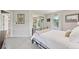 Bedroom with a mirrored closet door, soft lighting and windows to the exterior at 9385 Prairie View Dr, Highlands Ranch, CO 80126