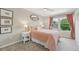 Bedroom featuring bright pink bedding, a ceiling fan, and ample natural light at 9385 Prairie View Dr, Highlands Ranch, CO 80126