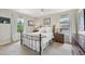 Comfortable bedroom with soft lighting and views to the exterior at 9385 Prairie View Dr, Highlands Ranch, CO 80126