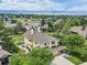 Gorgeous two-story home with mountain views, mature trees, and a well-manicured lawn creating an inviting curb appeal at 9385 Prairie View Dr, Highlands Ranch, CO 80126