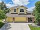 Charming two-story home featuring stone accents, a well-maintained lawn, and a spacious two-car garage at 9385 Prairie View Dr, Highlands Ranch, CO 80126