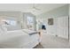 Bright main bedroom features vaulted ceiling, large windows, and view to bonus room at 9385 Prairie View Dr, Highlands Ranch, CO 80126