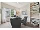 Bright office space featuring a window, stylish chairs, desk, and built-in shelving for an inspiring and productive atmosphere at 9385 Prairie View Dr, Highlands Ranch, CO 80126