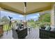 Relaxing porch area with outdoor seating, telescope and a scenic view at 9385 Prairie View Dr, Highlands Ranch, CO 80126