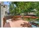 Cozy back deck surrounded by lush greenery, perfect for outdoor dining and relaxation at 11313 Haswell Dr, Parker, CO 80134