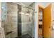 Modern bathroom featuring a glass-enclosed shower with gray tiling and a built-in bench at 11313 Haswell Dr, Parker, CO 80134