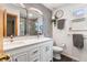 Bright bathroom with double vanity, sleek mirrors, and modern fixtures at 11313 Haswell Dr, Parker, CO 80134