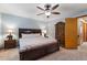 Bedroom featuring ceiling fan and dark wood furnishings at 11313 Haswell Dr, Parker, CO 80134