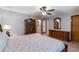 Bedroom with a ceiling fan, floral bedding, and natural light at 11313 Haswell Dr, Parker, CO 80134