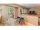 Bright breakfast nook with a table for two and a view of the outdoor deck at 11313 Haswell Dr, Parker, CO 80134
