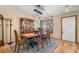 A beautifully staged dining room with hardwood floors, a vintage hutch, and a stylish light fixture at 11313 Haswell Dr, Parker, CO 80134