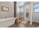 Spa-like bathroom featuring a soaking tub and walk-in shower at 2800 S Dexter Way, Denver, CO 80222