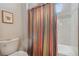 Clean bathroom with shower/tub combo and colorful curtain at 2800 S Dexter Way, Denver, CO 80222