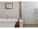 Modern bathroom with soaking tub and a walk-in shower at 2800 S Dexter Way, Denver, CO 80222