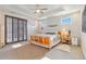 Bright bedroom with wood floors and access to a private deck at 2800 S Dexter Way, Denver, CO 80222