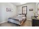 Comfortable bedroom with a queen-size bed and window at 2800 S Dexter Way, Denver, CO 80222