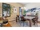 Modern dining room with large table and unique light fixture at 2800 S Dexter Way, Denver, CO 80222