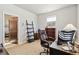 Home office featuring a desk, chair, and built-in shelving at 2800 S Dexter Way, Denver, CO 80222