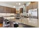 Modern kitchen with a large island and breakfast bar at 2800 S Dexter Way, Denver, CO 80222