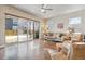 Living room with hardwood floors, sliding glass doors, and access to backyard at 2800 S Dexter Way, Denver, CO 80222