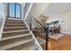 Modern staircase with metal railing leading to upper level at 2800 S Dexter Way, Denver, CO 80222