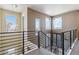 Bright upper landing with multiple windows and a view at 2800 S Dexter Way, Denver, CO 80222