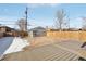 Large backyard with a composite deck and detached garage at 1835 S Lincoln St, Denver, CO 80210