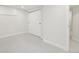 Bright basement bedroom with neutral carpeting and ample closet space at 1835 S Lincoln St, Denver, CO 80210