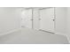 Simple and bright basement bedroom with two closets and neutral decor at 1835 S Lincoln St, Denver, CO 80210