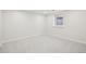 Unfinished basement with a window providing natural light, ready for customization at 1835 S Lincoln St, Denver, CO 80210