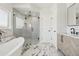 Elegant bathroom featuring a soaking tub and shower at 1835 S Lincoln St, Denver, CO 80210