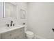 Modern bathroom with a sleek vanity, a lighted mirror, and mosaic tile floor at 1835 S Lincoln St, Denver, CO 80210