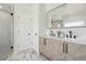 Modern bathroom with a double vanity and marble floors at 1835 S Lincoln St, Denver, CO 80210